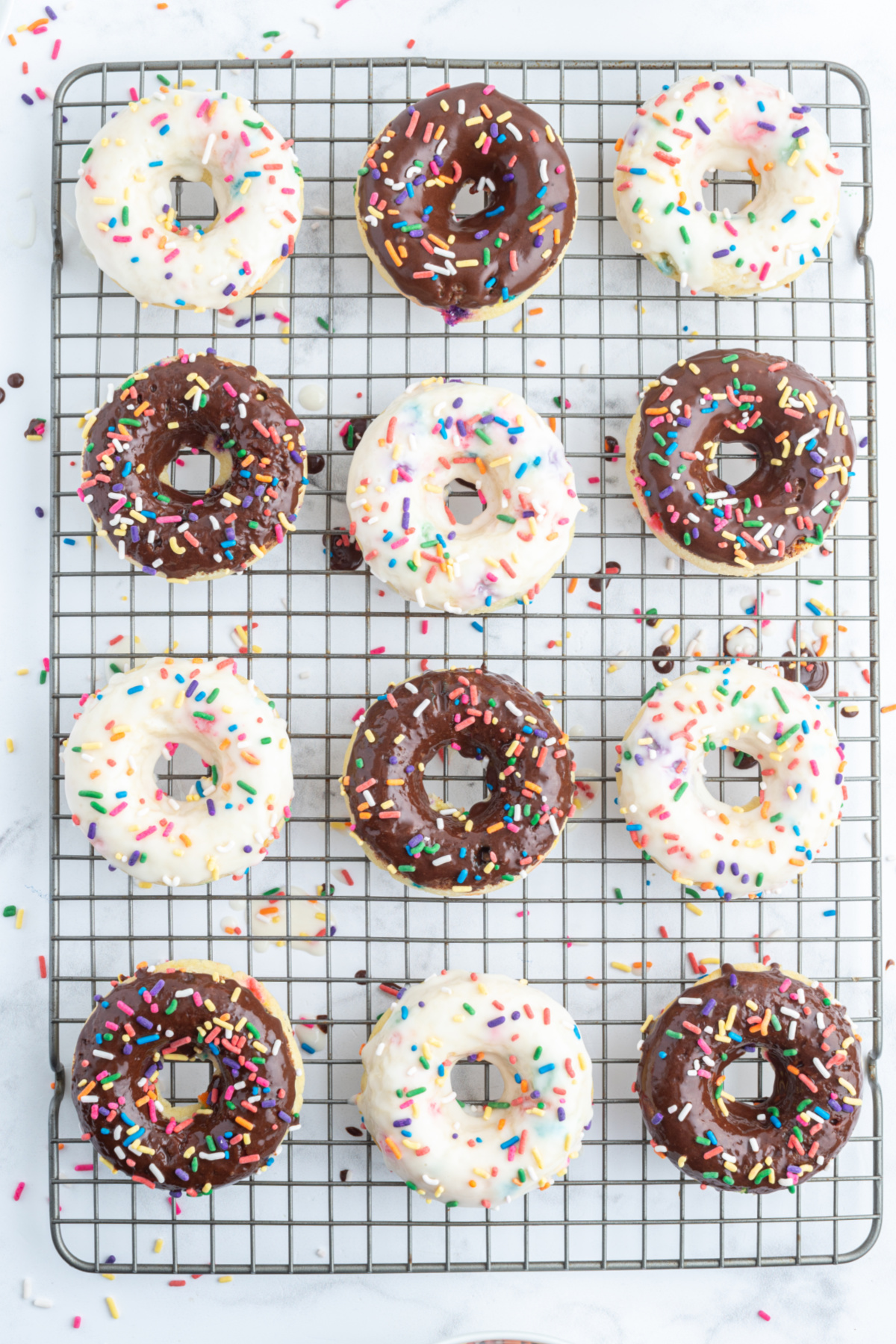 frosted cake mix donuts on a cooling rack