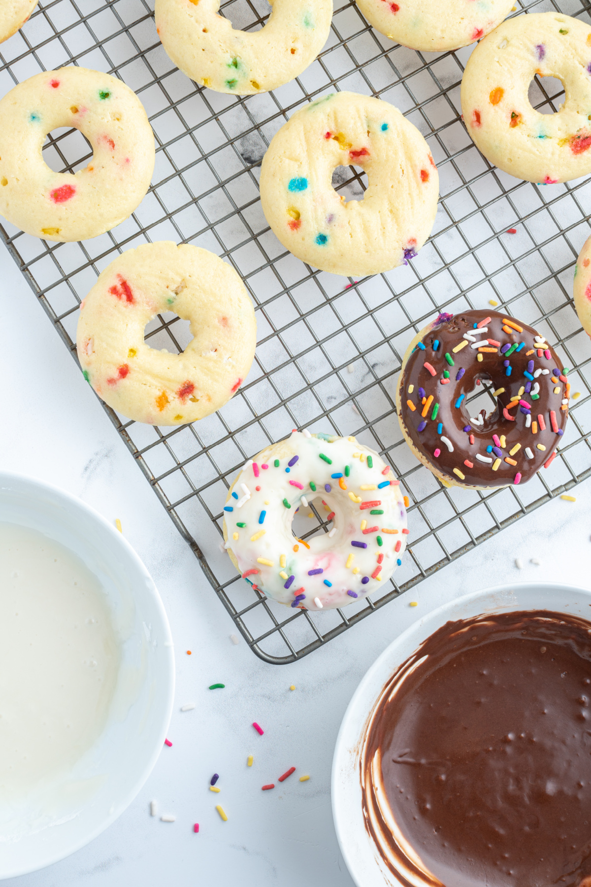 cake mix donuts on a cooling rack some frosted