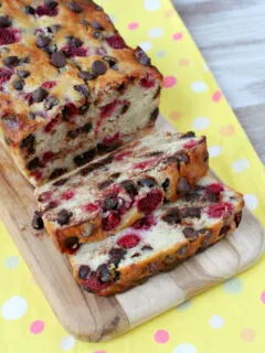 loaf of raspberry dark chocolate banana bread on board and sliced