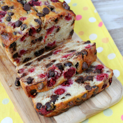 loaf of raspberry dark chocolate banana bread on board and sliced