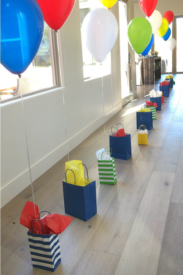 Birthday celebration idea: attaching balloons to gifts using the number of gifts to match the age