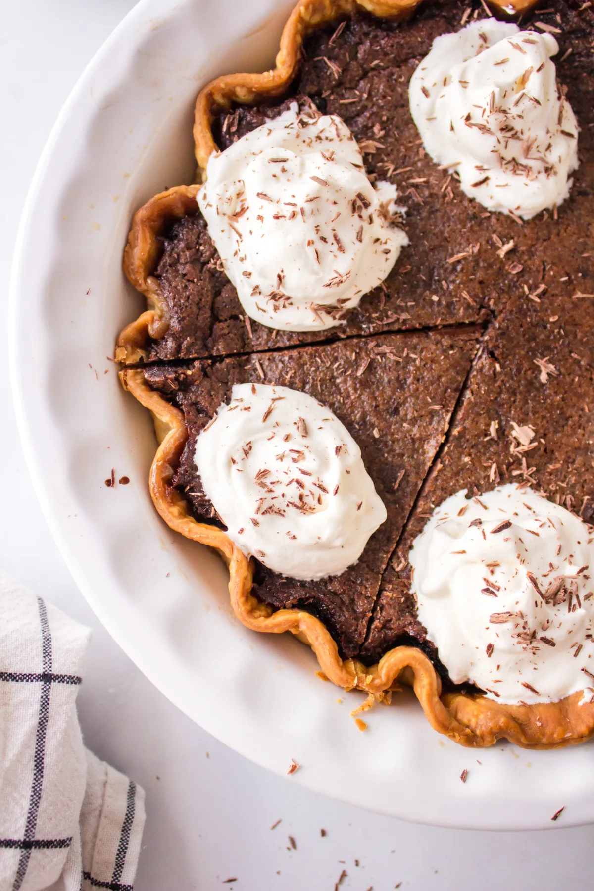 chocolate chess pie with one slice sliced