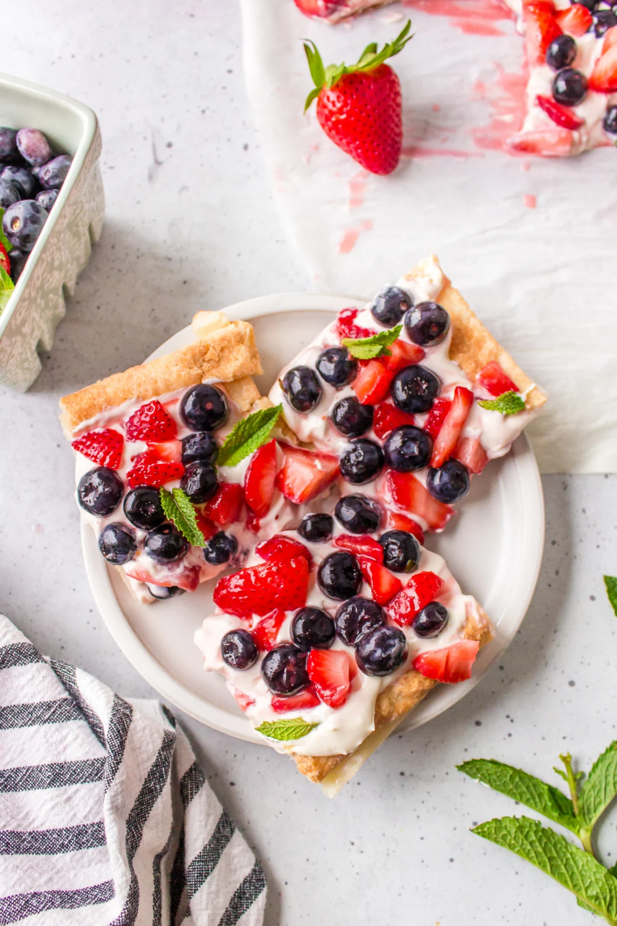 slices of berry cheesecake tart on plate