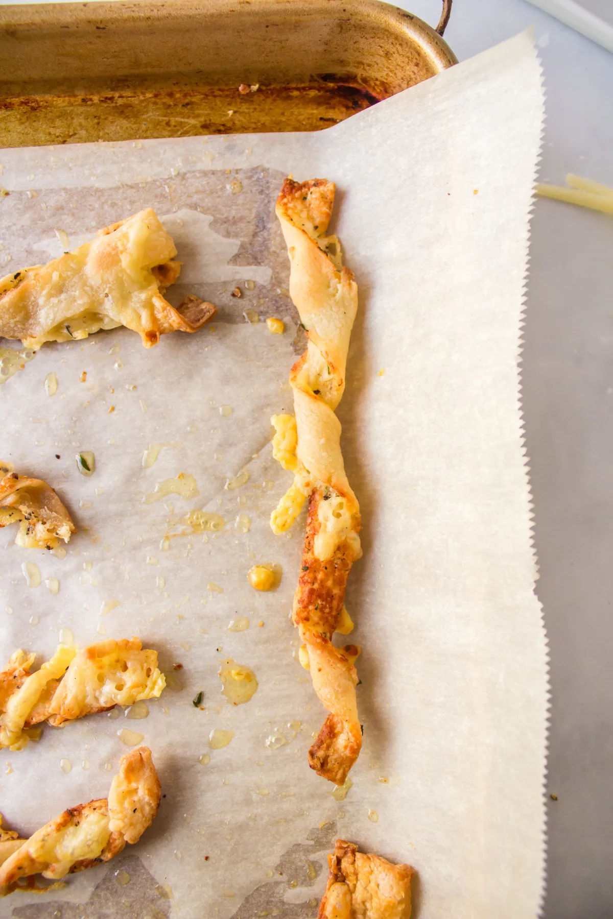 cheese straws baked on baking sheet