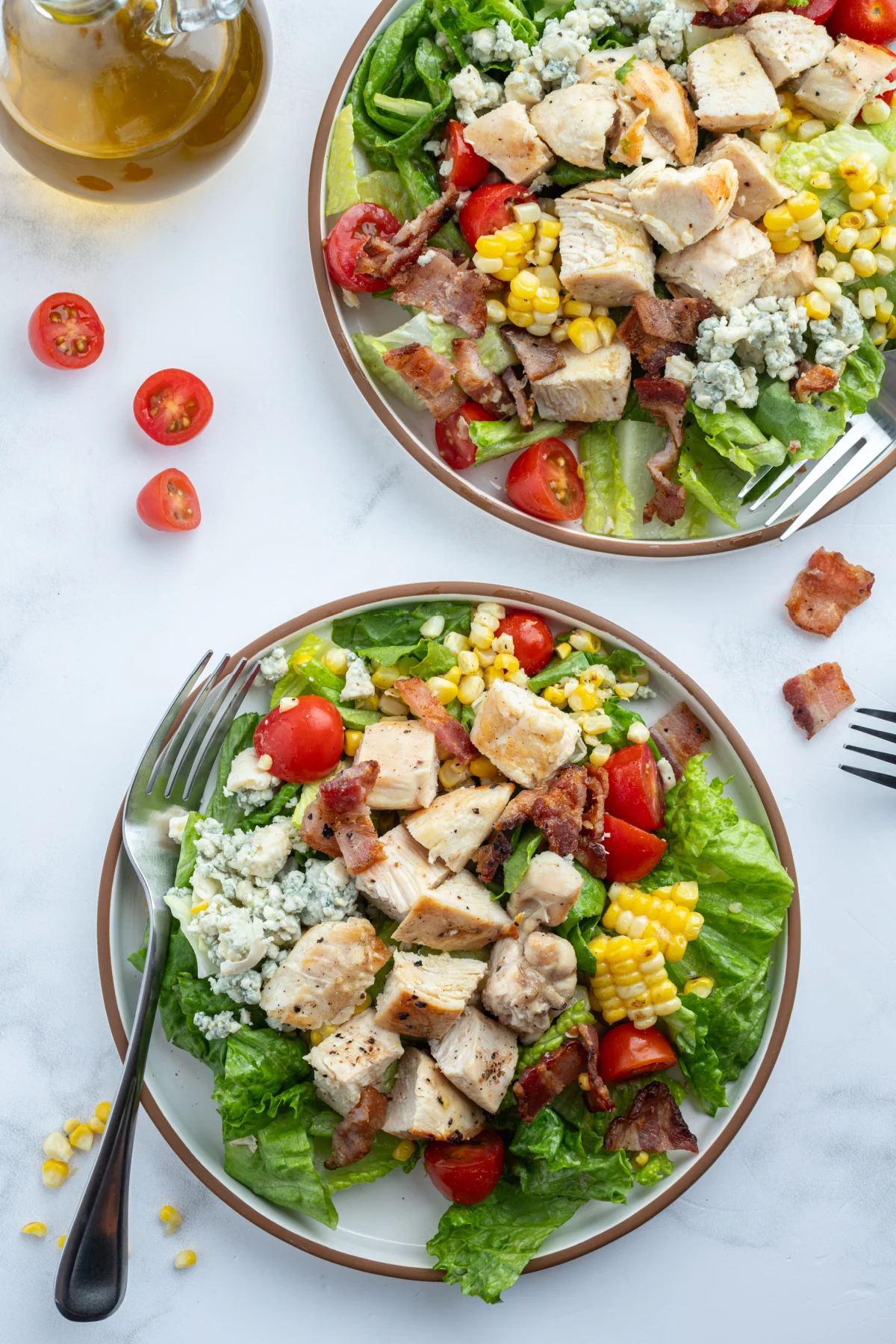 two plates of grilled cobb salad