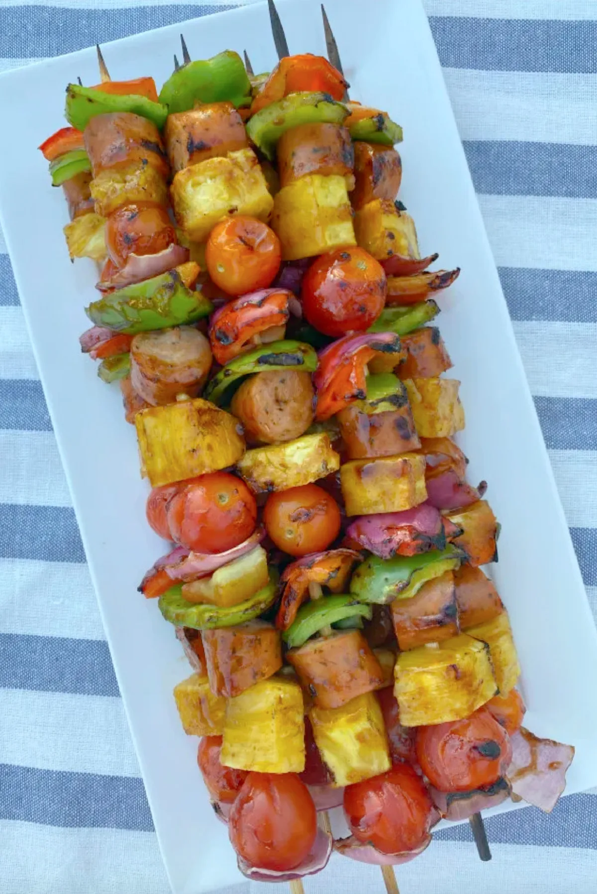 hawaiian chicken sausage kabobs on platter