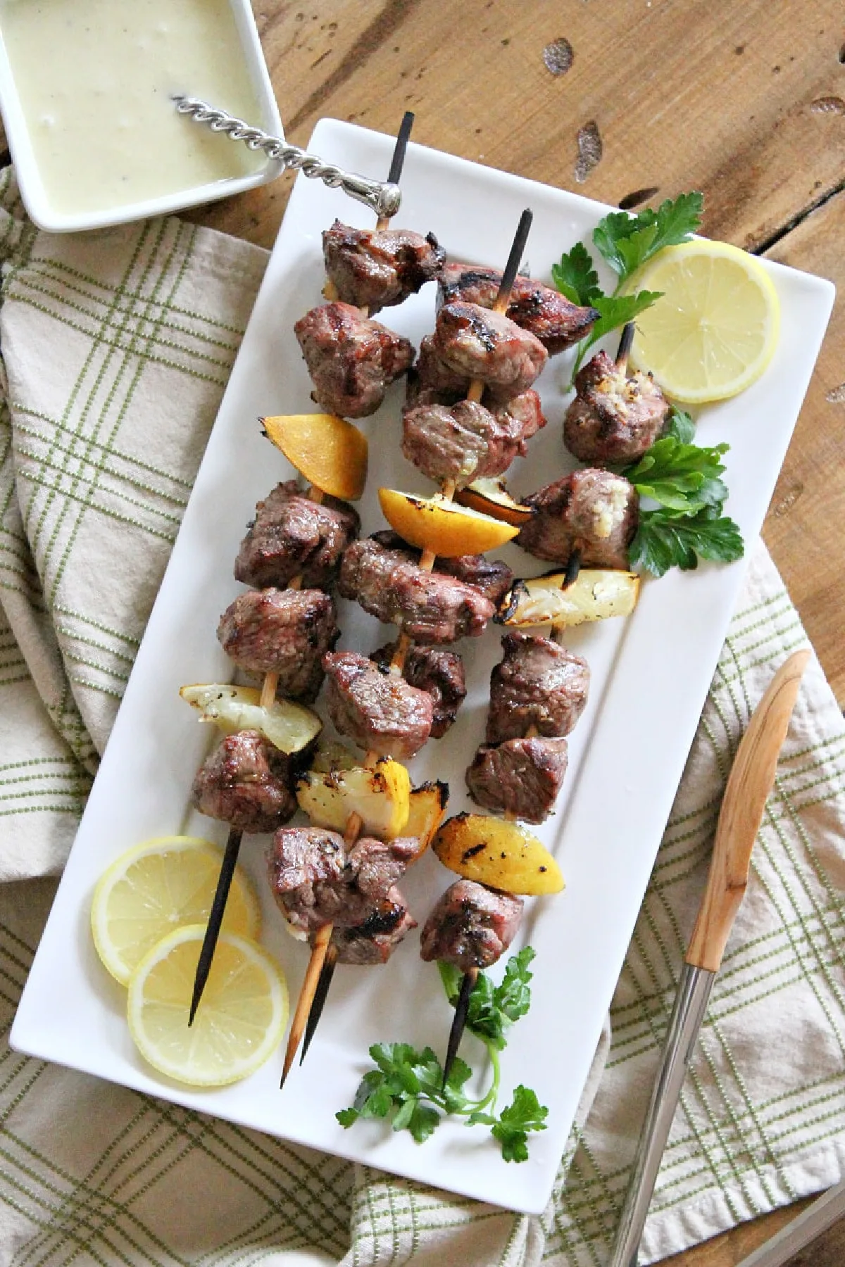 lemon garlic lamb kebabs on a platter