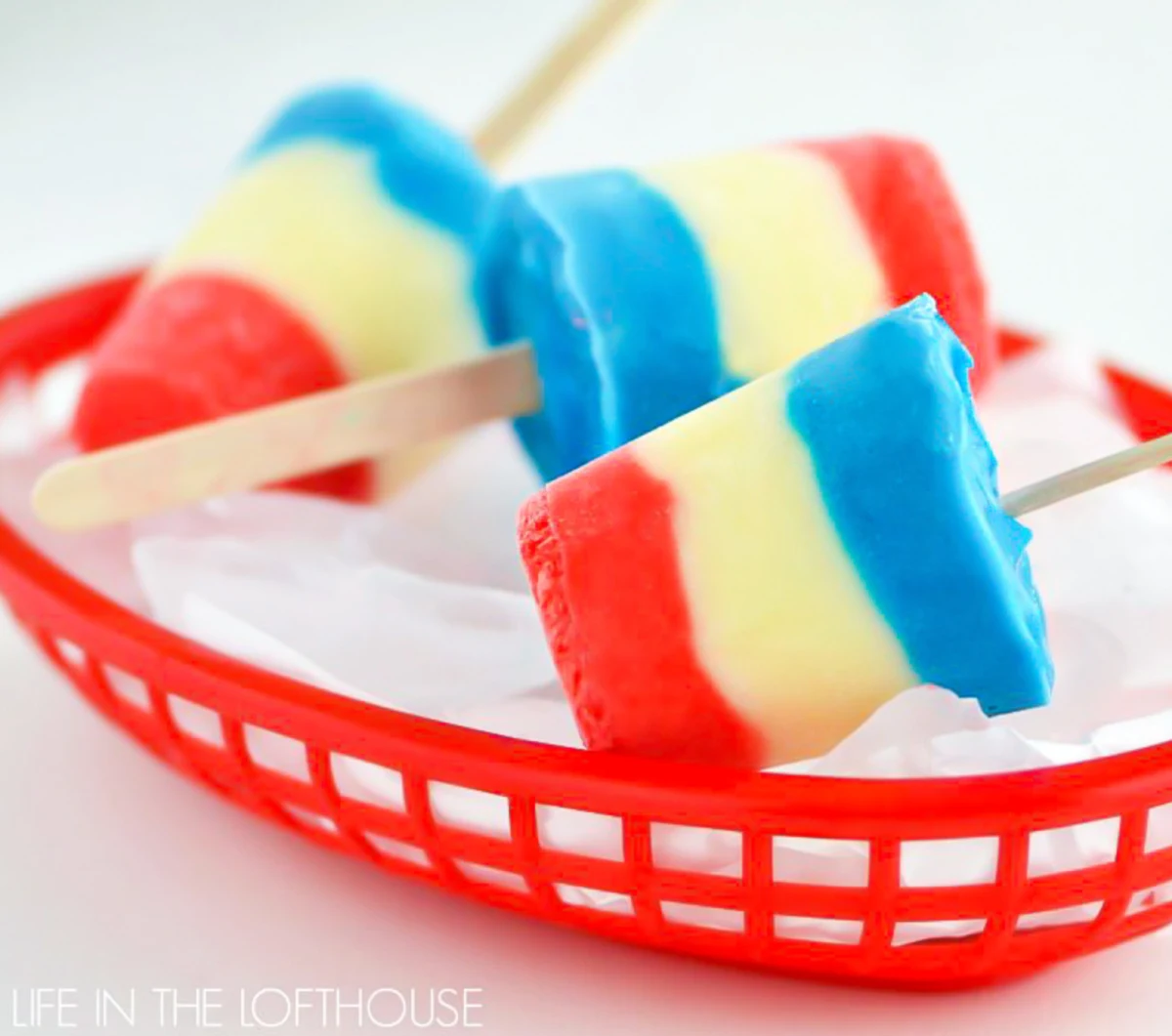 basket of red white and blue pudding pops