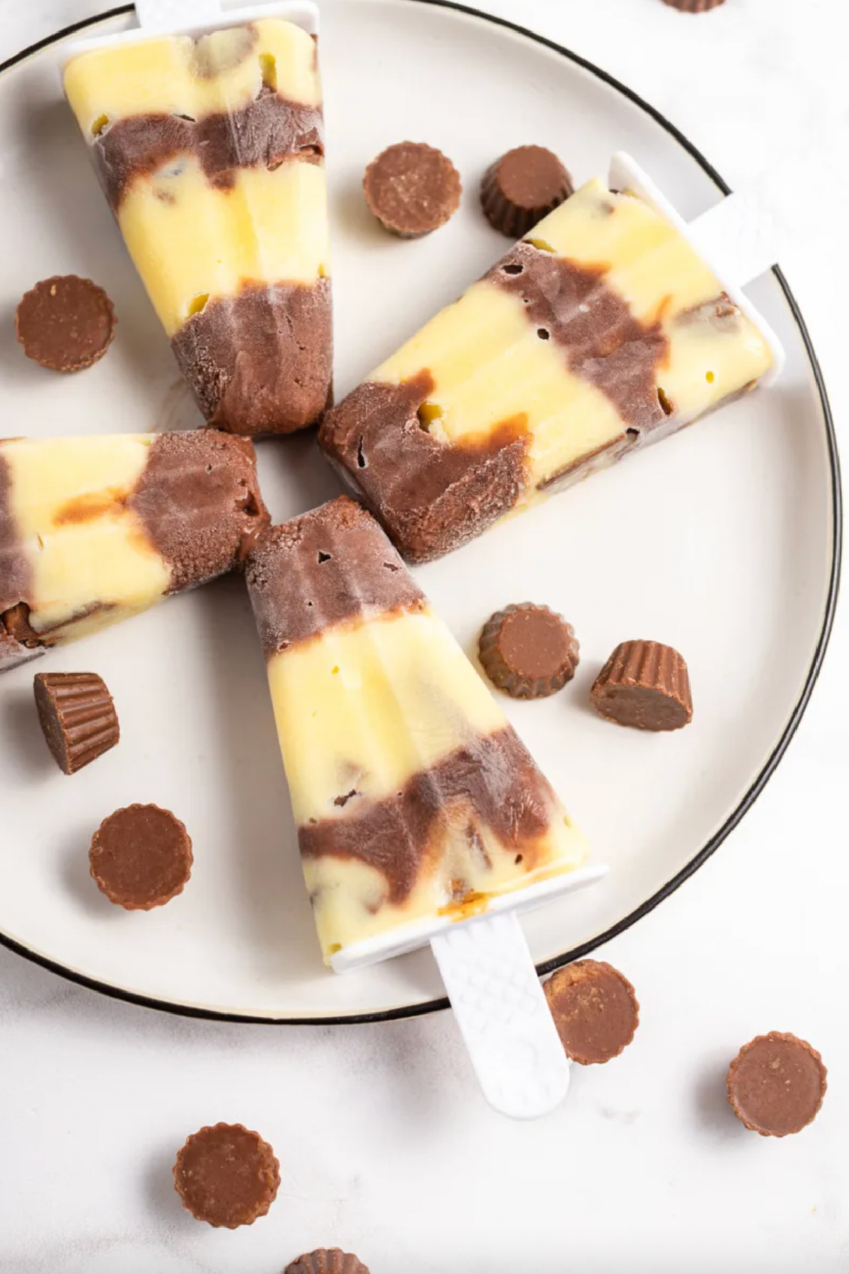 four reeses pudding pops on plate