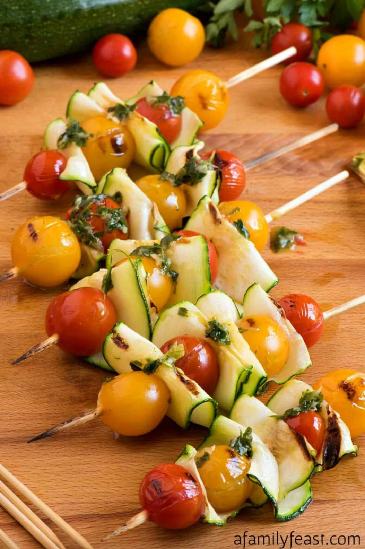 zucchini and tomato kebabs with fresh herb dressing