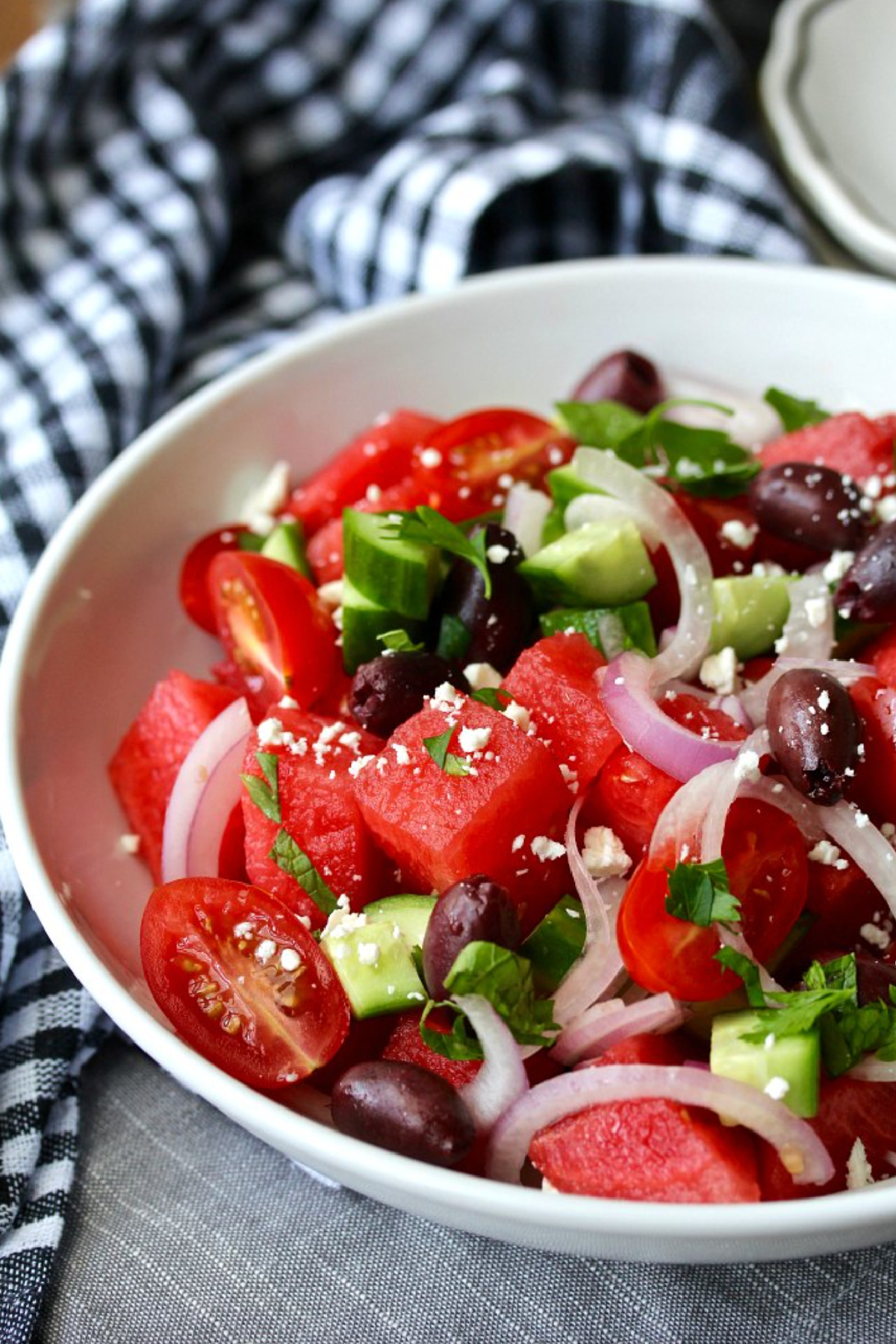 bowl of greek style watermelon and tomato salad