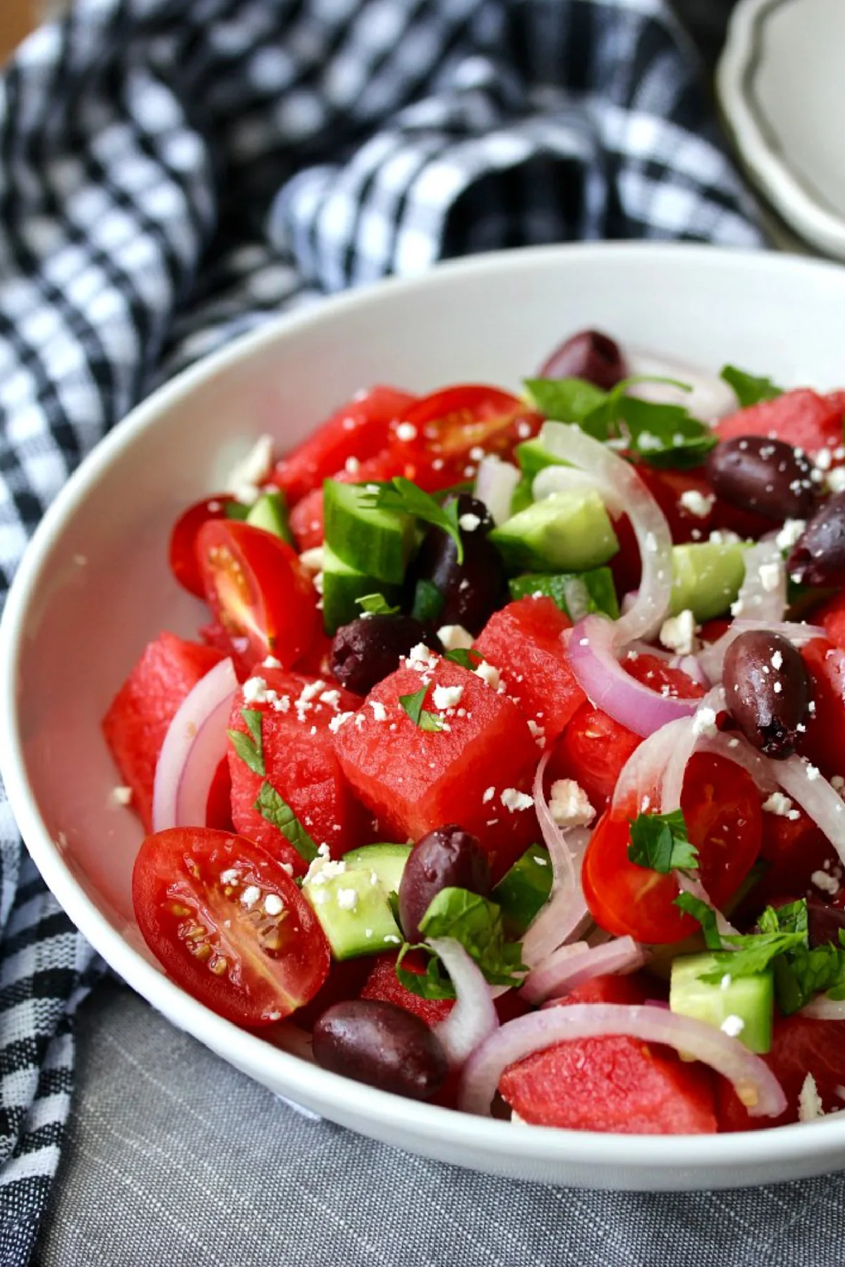 bowl of greek style watermelon and tomato salad