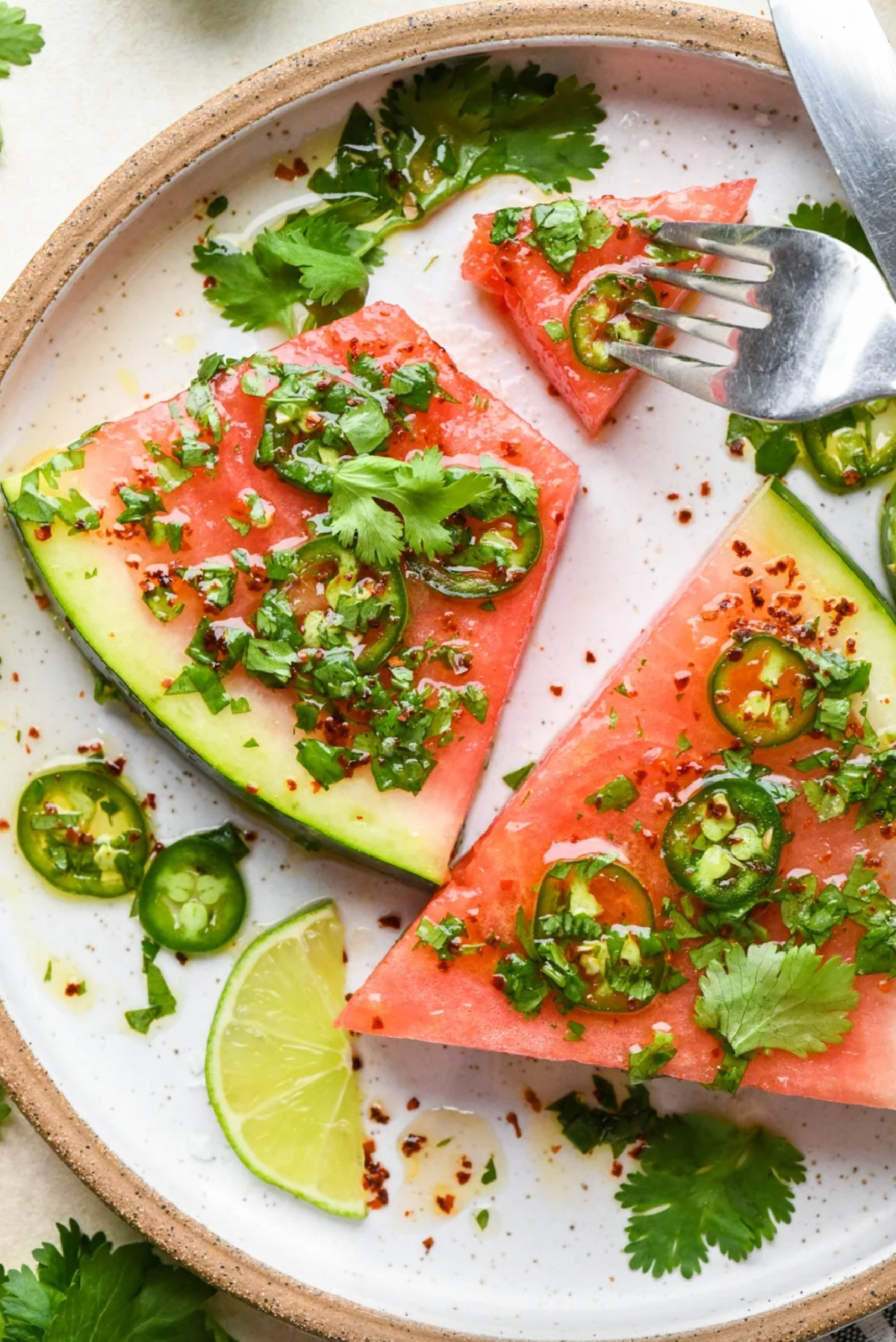 spicy watermelon salad with cilantro and lime on plate