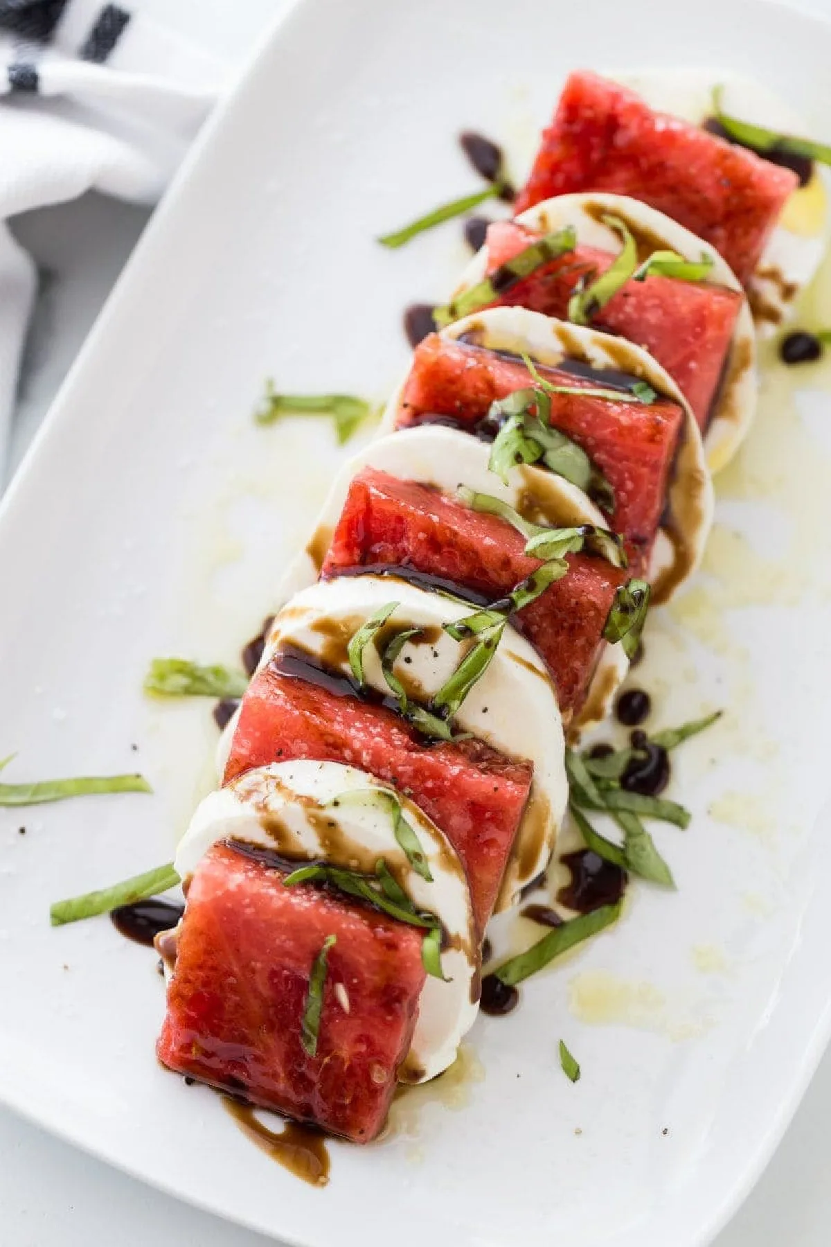 watermelon caprese salad on platter