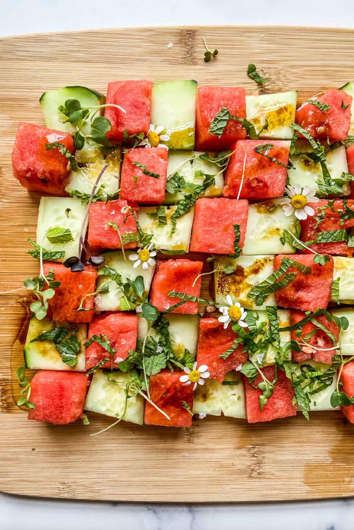 watermelon cucumber mosaic salad on board