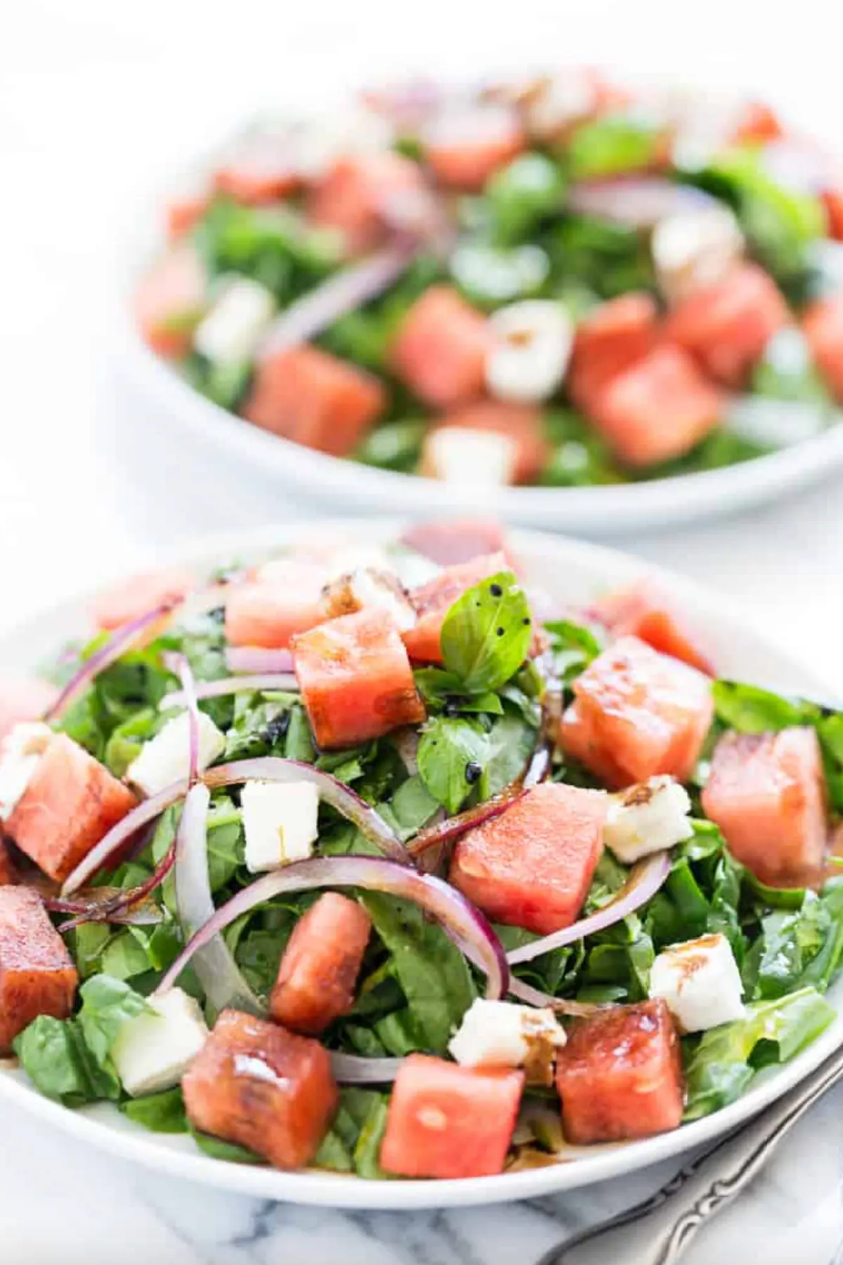 bowls of watermelon feta spinach salad