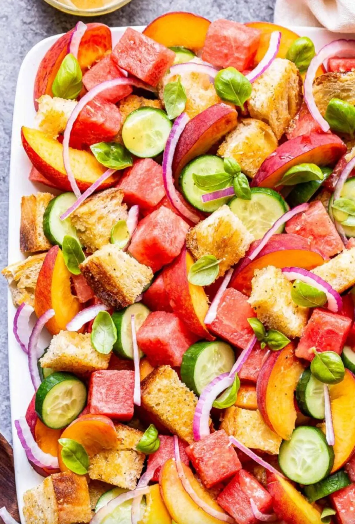 watermelon peach panzanella salad on platter