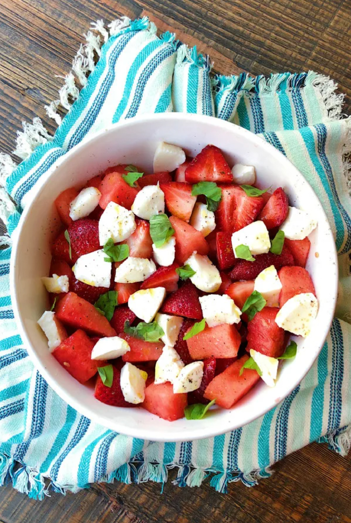 bowl of watermelon strawberry caprese salad