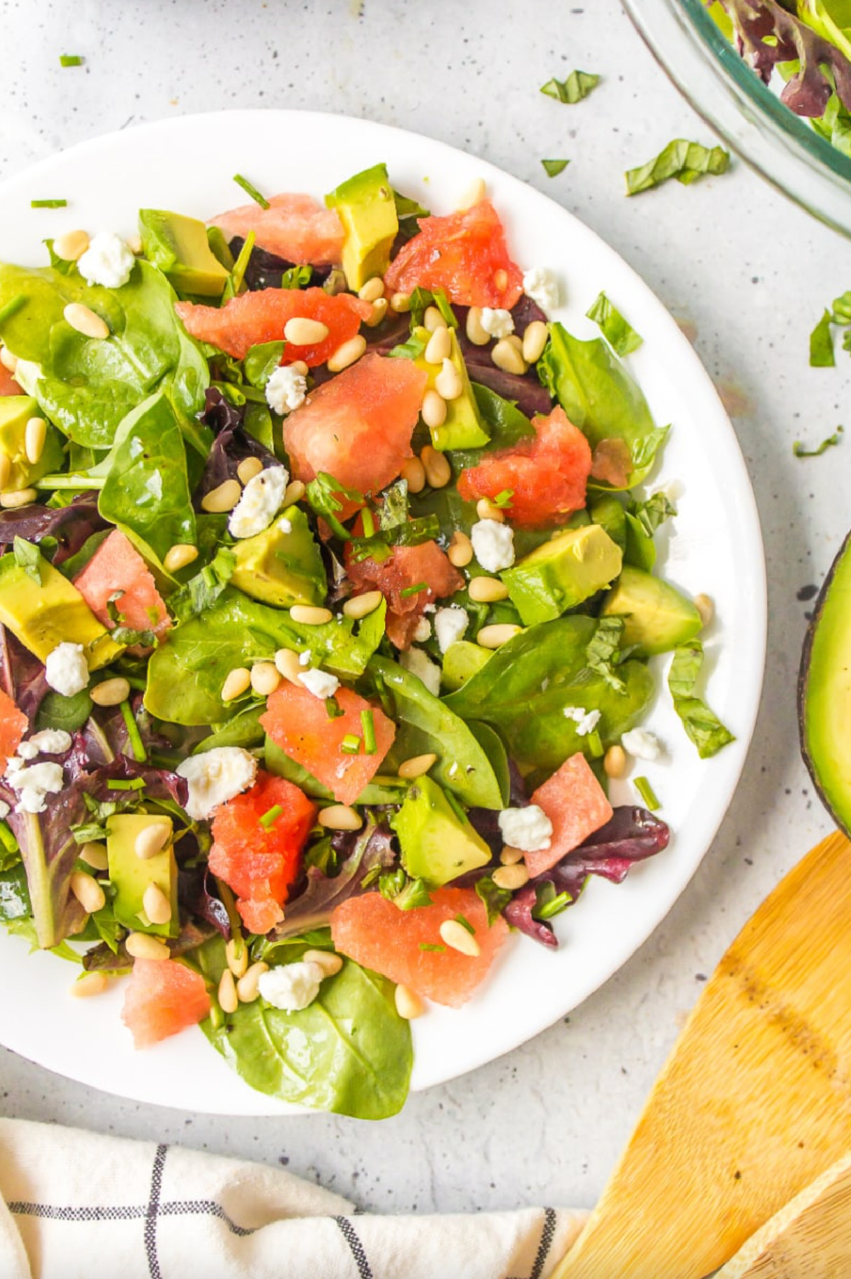 watermelon and avocado salad in white bowl