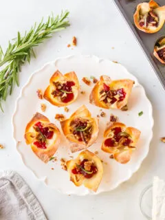 six cranberry brie bites appetizers on a plate