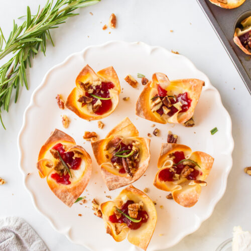 six cranberry brie bites appetizers on a plate