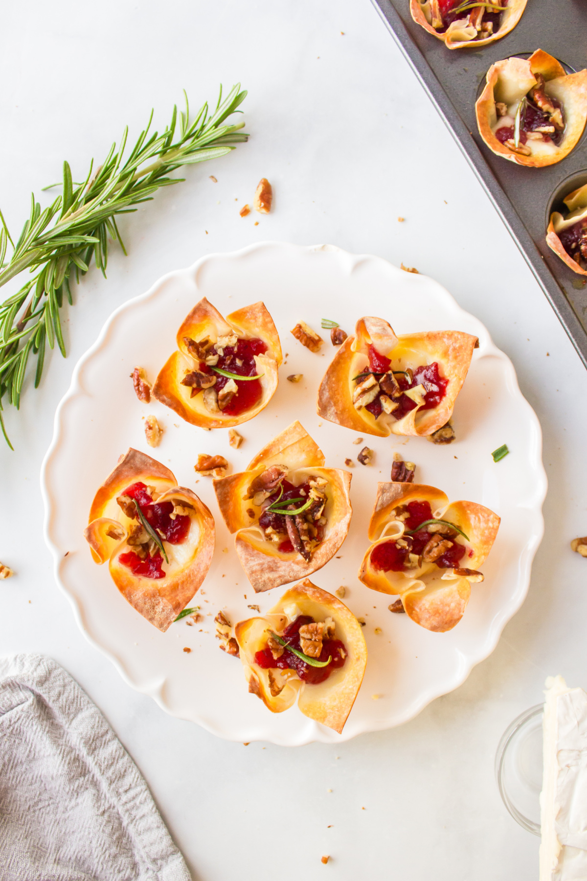 six cranberry brie bites appetizers on a plate