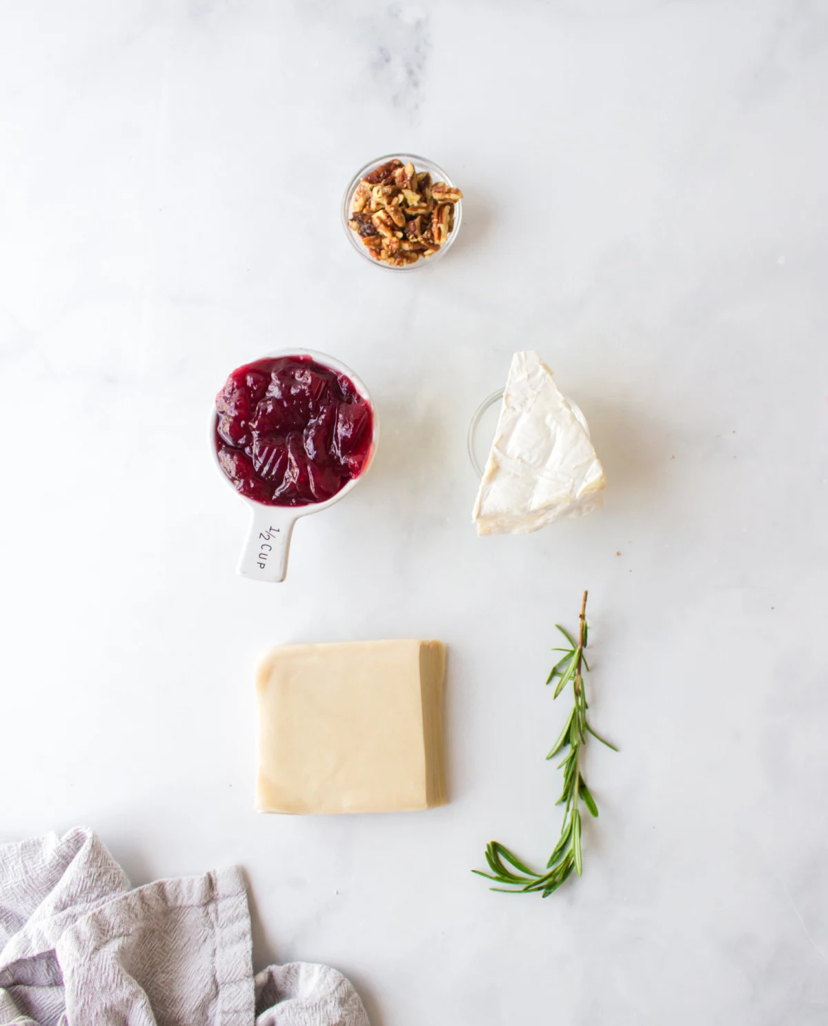 ingredients displayed for making cranberry brie bites