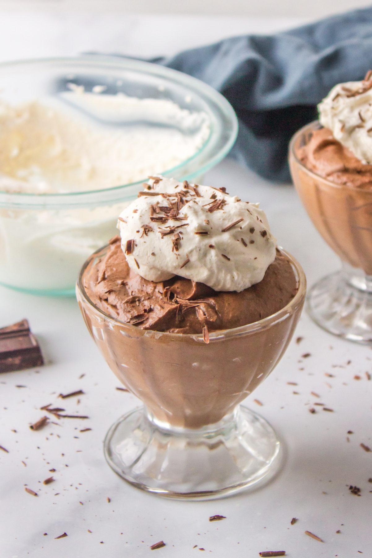 glass of chocolate mousse with whipped cream on top