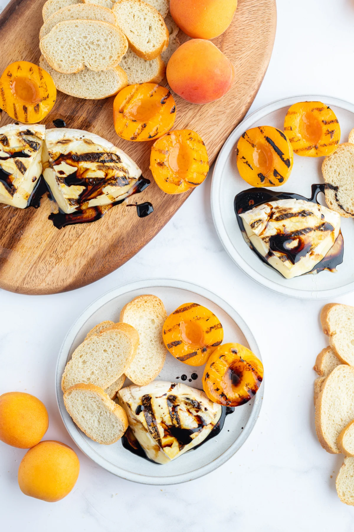 plates of grilled brie with balsamic glaze and apricots