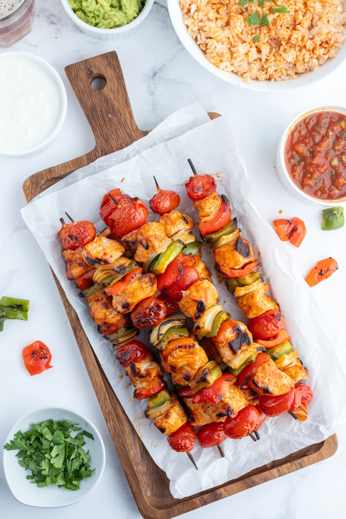 grilled chicken taco kebabs on a rectangular platter