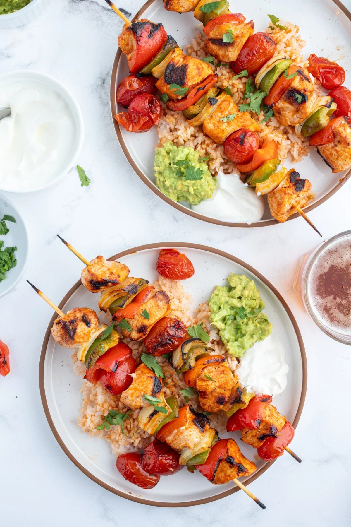 grilled chicken taco kebabs on two plates