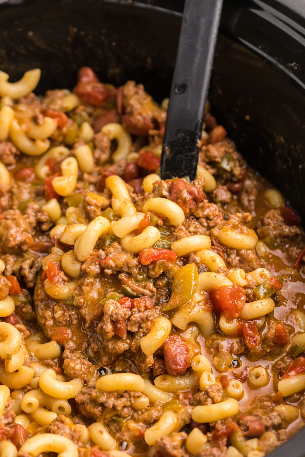 slow cooker full of beef chili mac