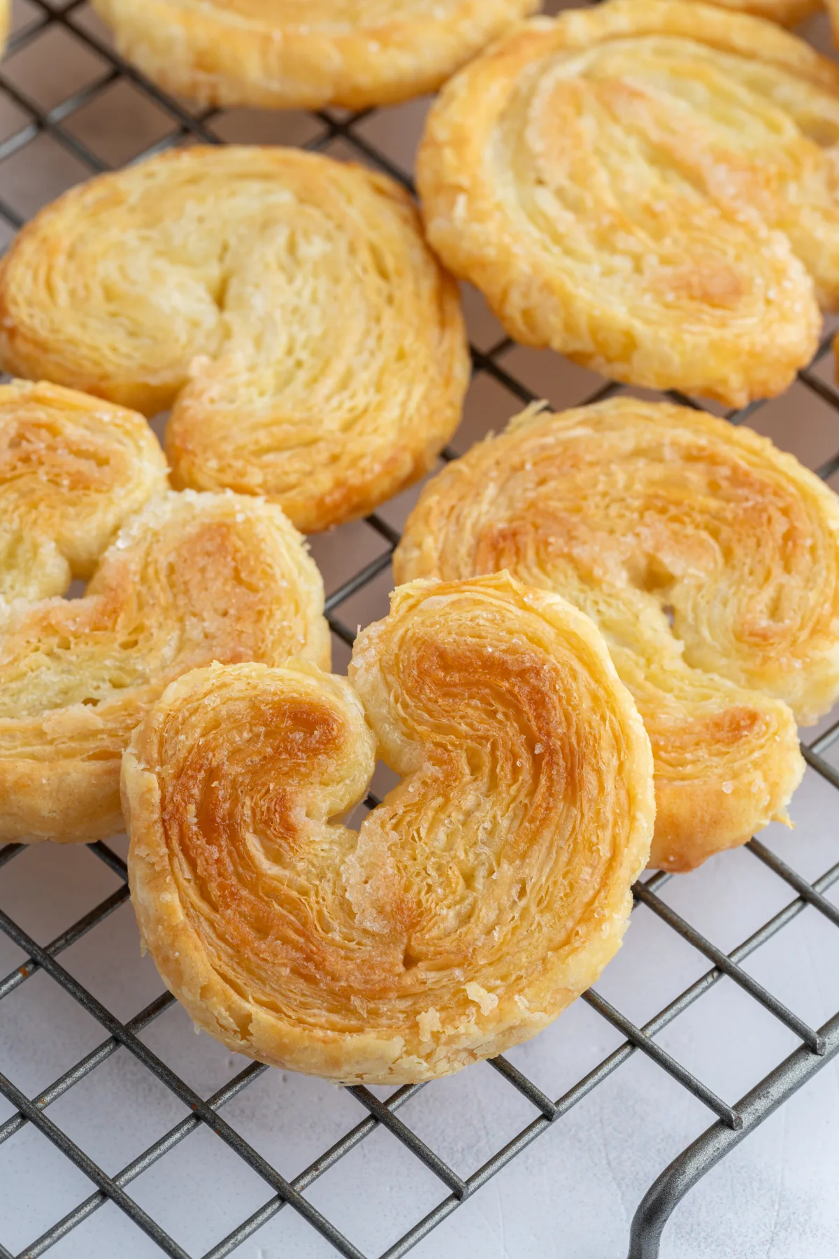 palmier cookies on a cooling rack