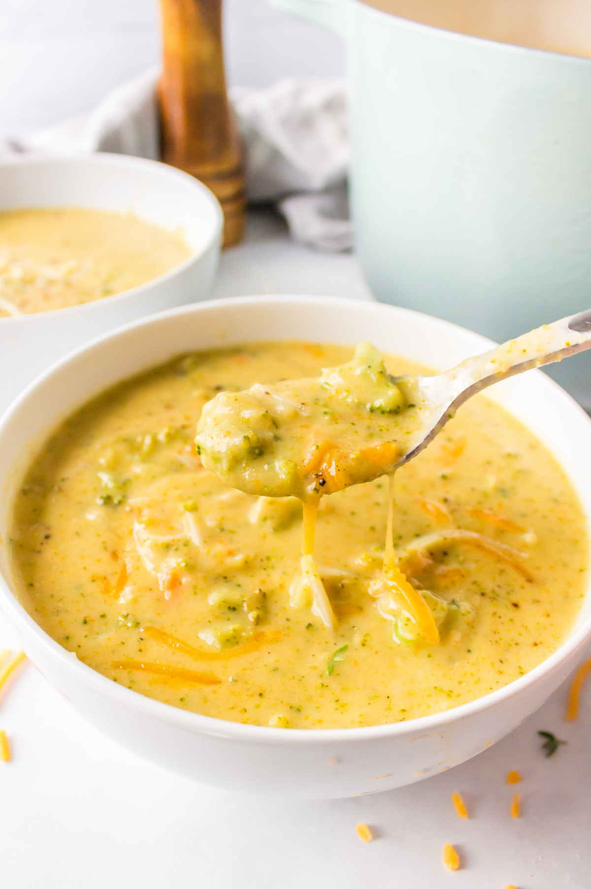 bowl of broccoli cheese soup with spoon