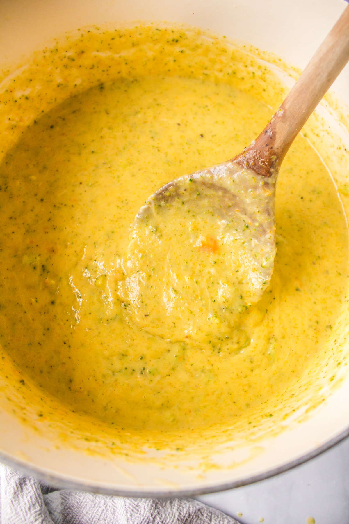 spoon in pot of 20 minute broccoli cheese soup