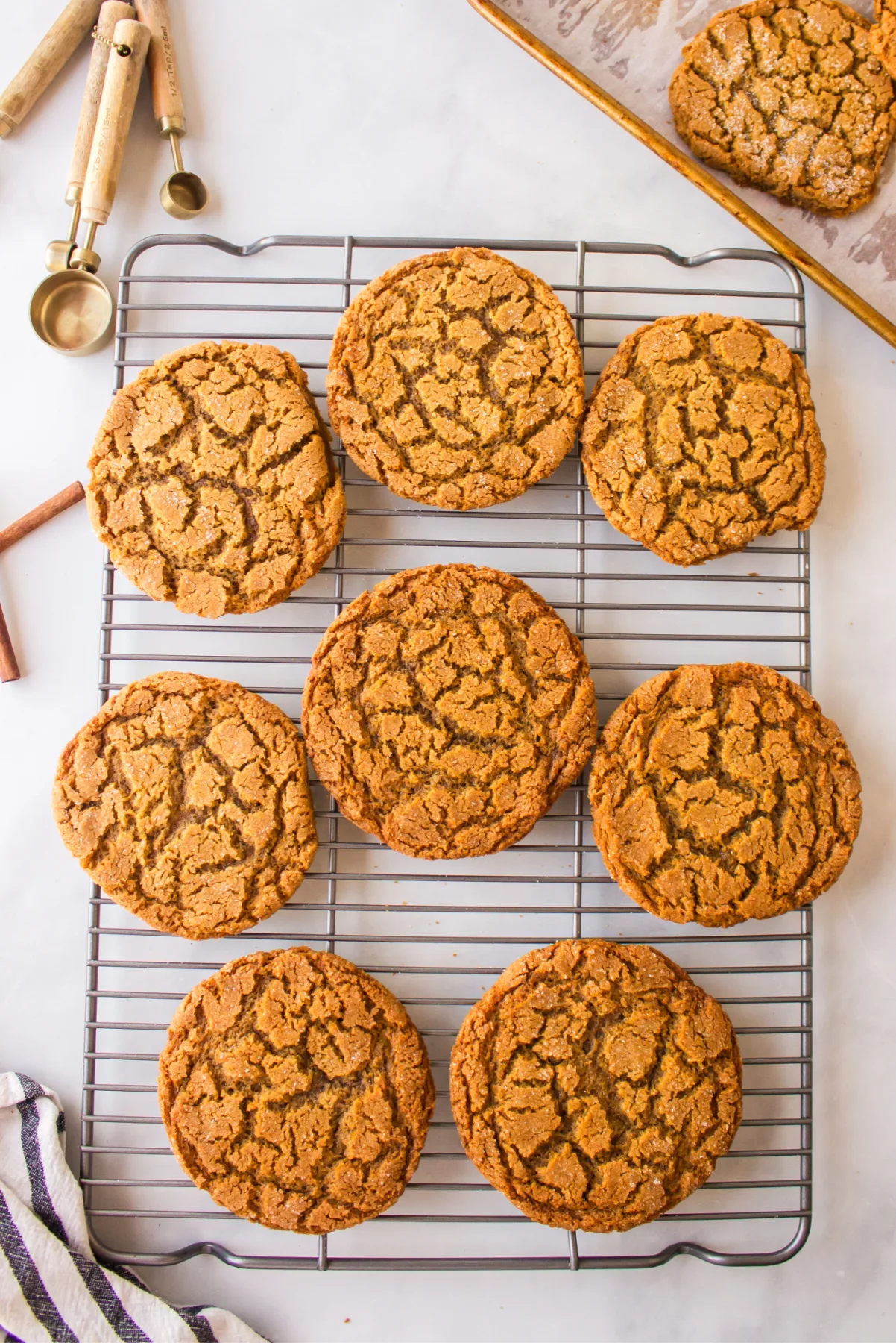 crackle top molasses cookies on cooling rack