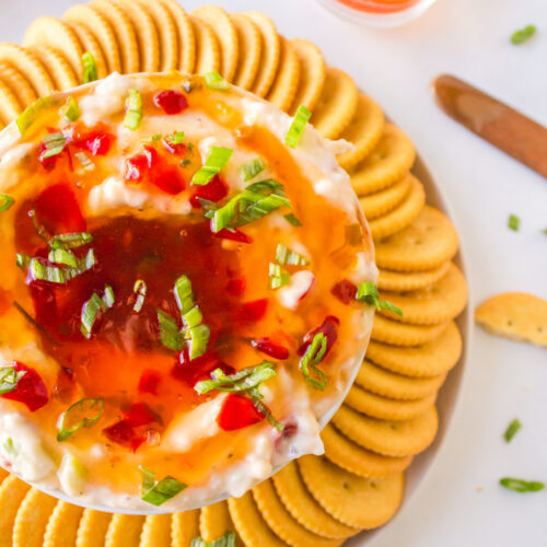 pepper jelly cream cheese dip surrounded by crackers