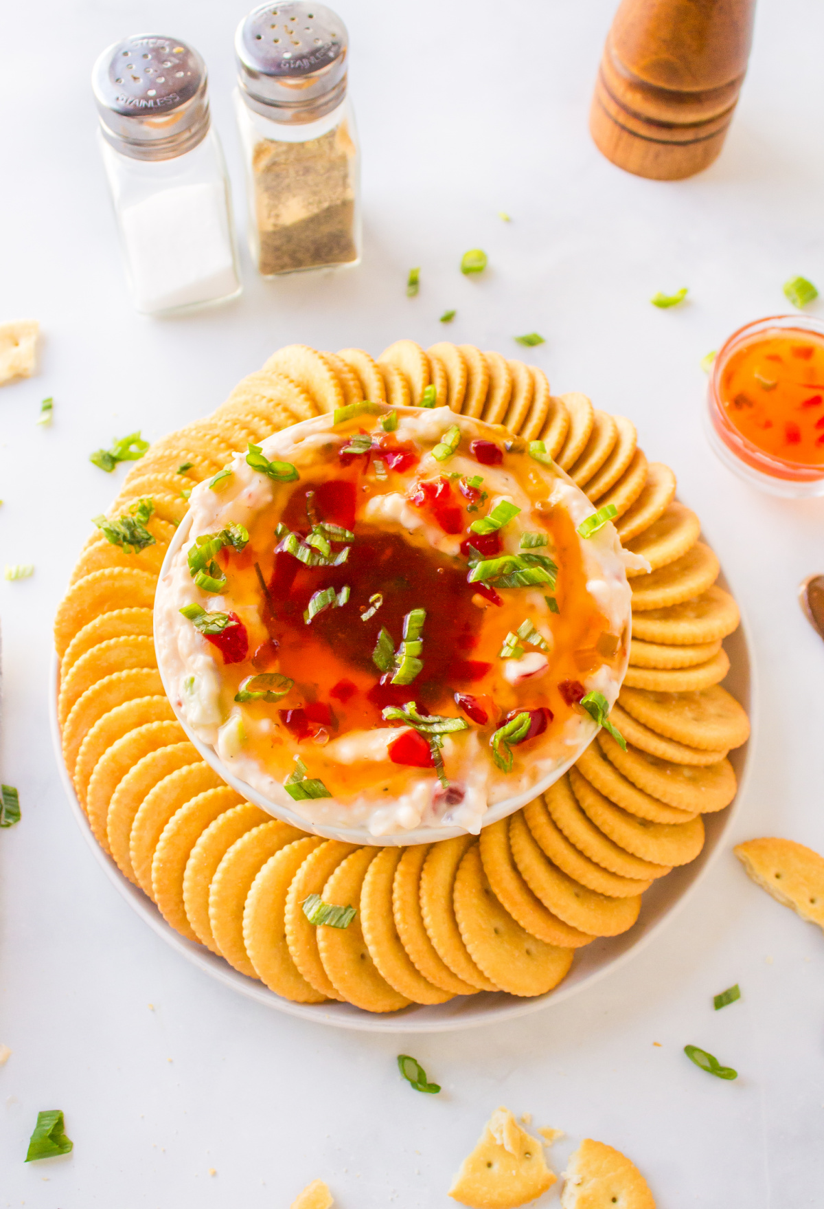 pepper jelly cream cheese dip surrounded by crackers