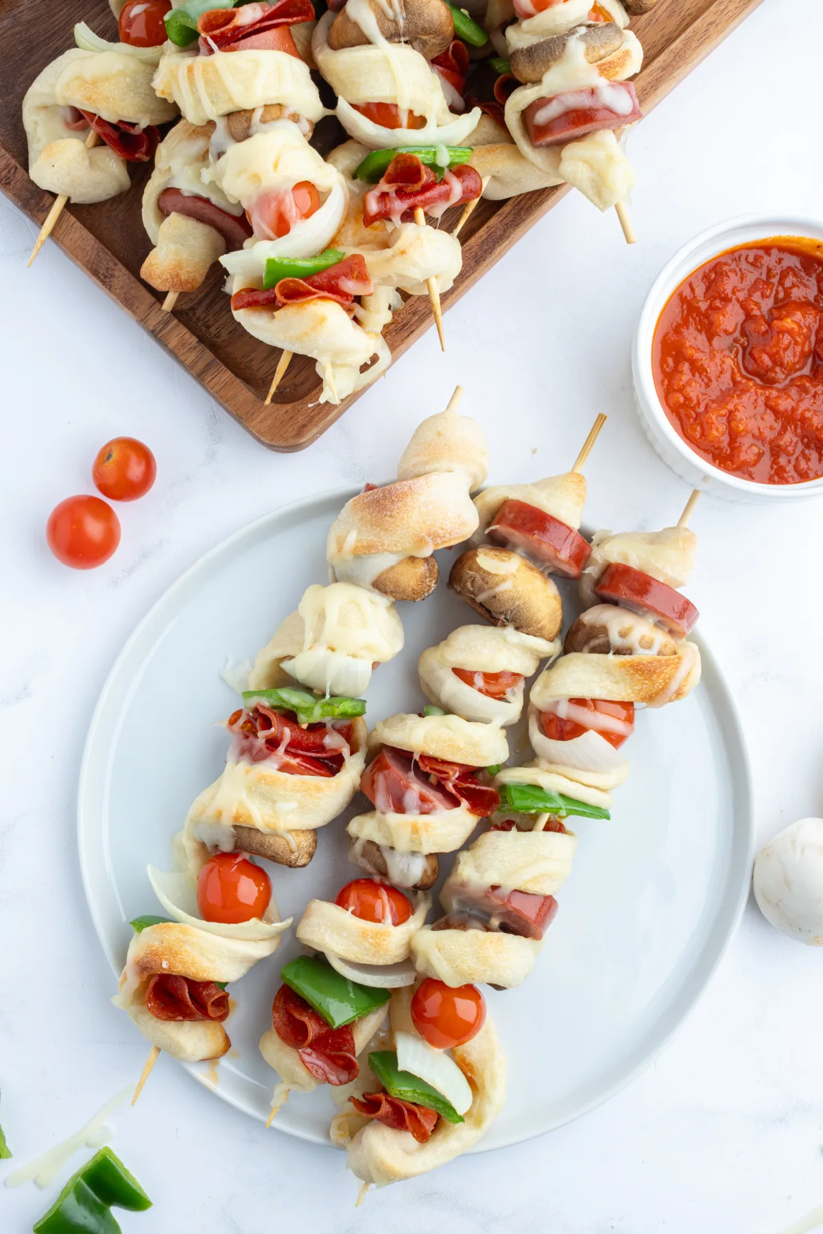 three pizza kabobs on plate