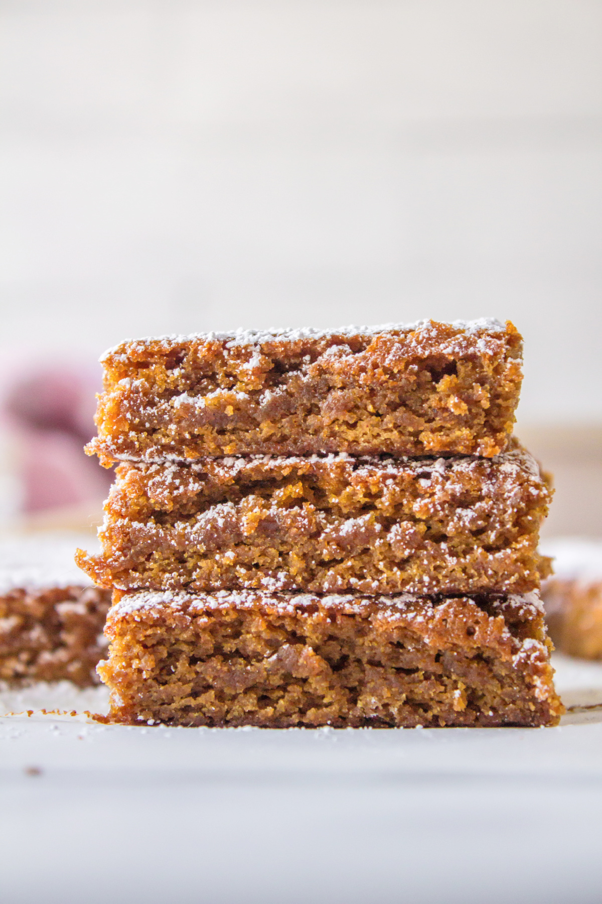 three stacked gingerbread blondies close up