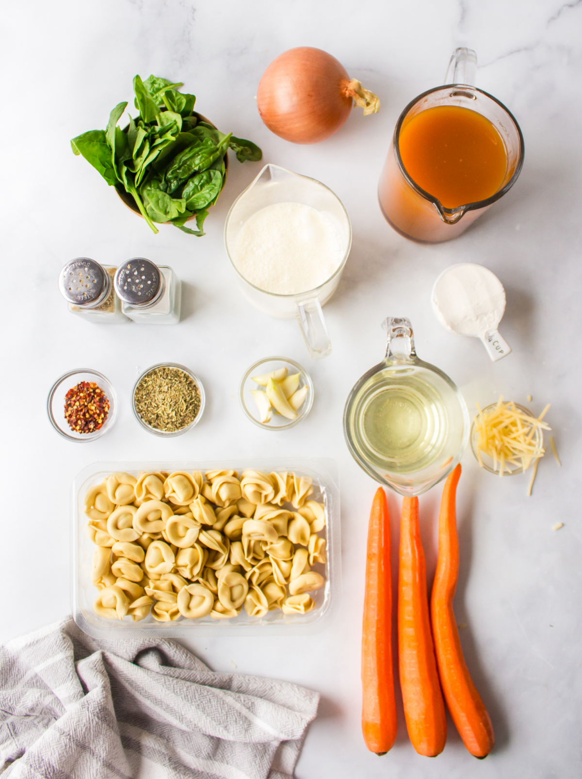 ingredients displayed for making cheese tortellini soup