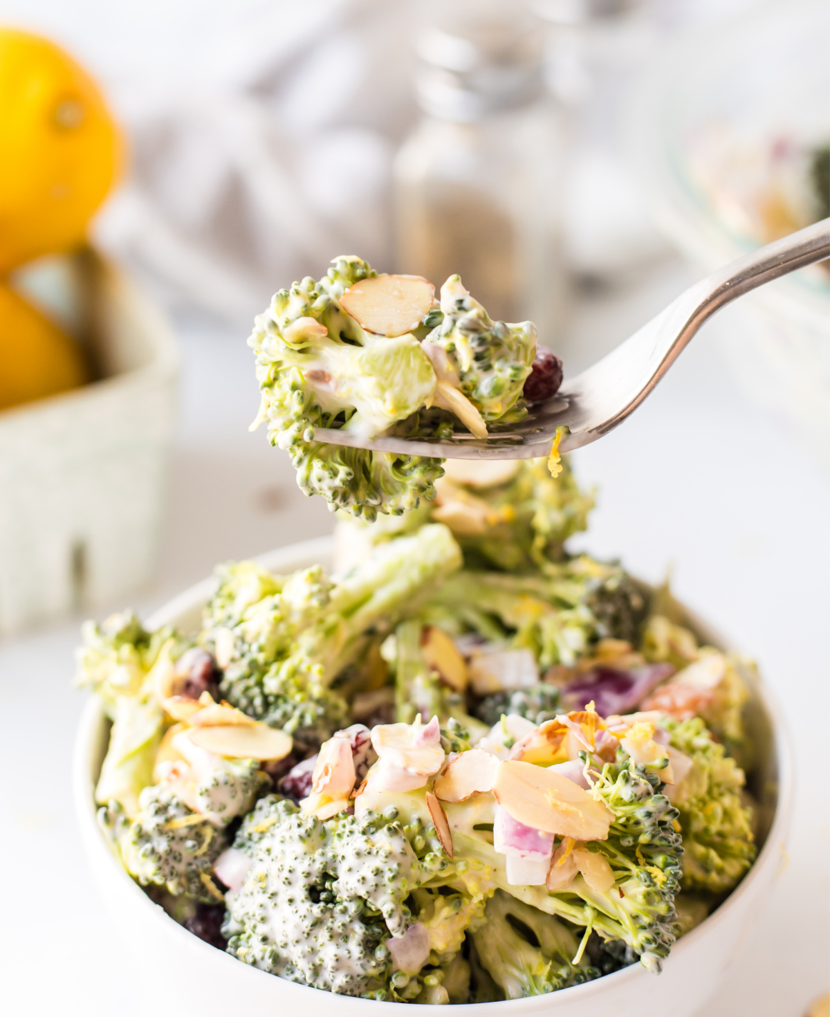 Fork full of broccoli crunch salad